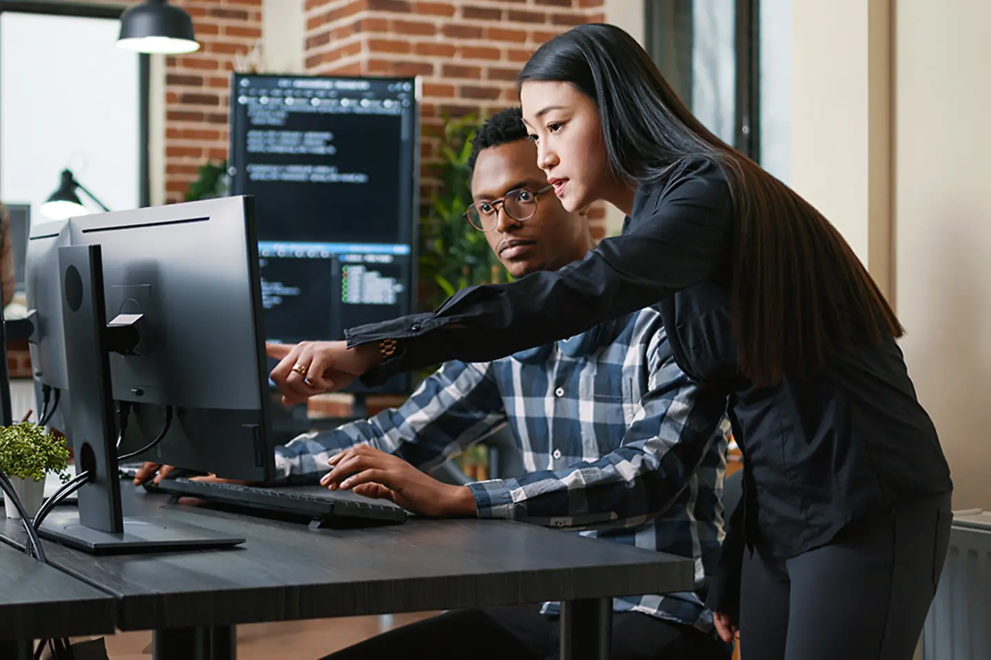 Security team working on cyber attacks on laptop