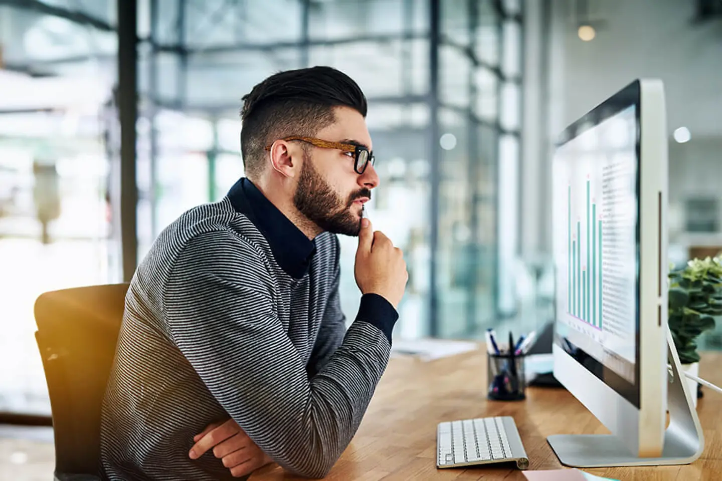 Male professional using laptop
