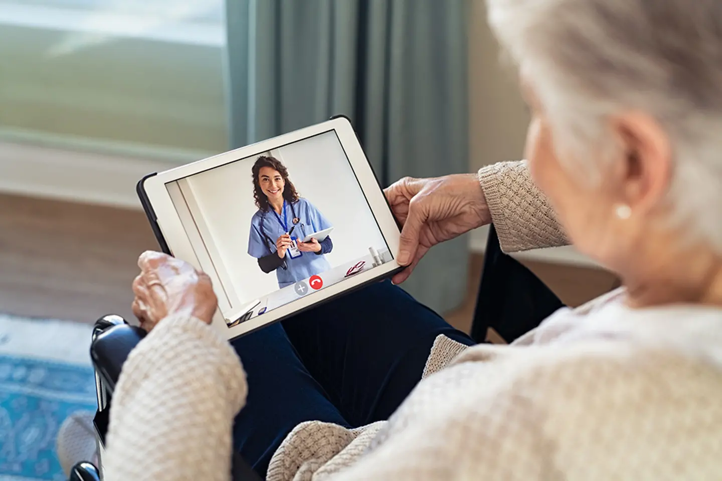 A video call in progress between a doctor and a patient.