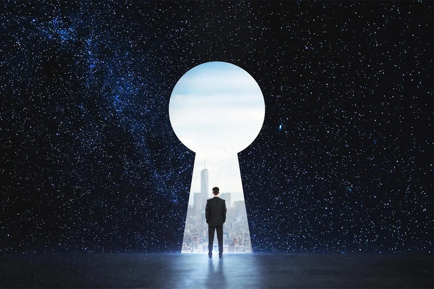 A businessman stands in a keyhole-shaped doorway under a starry sky, with a big city in front of him