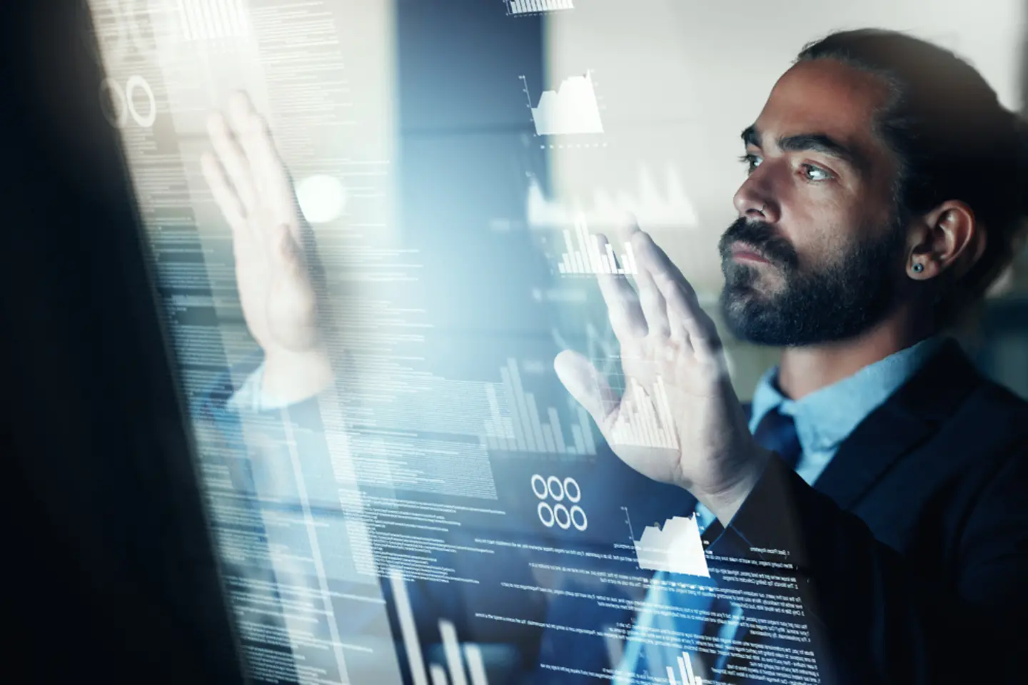 A business man works on futuristic technology.