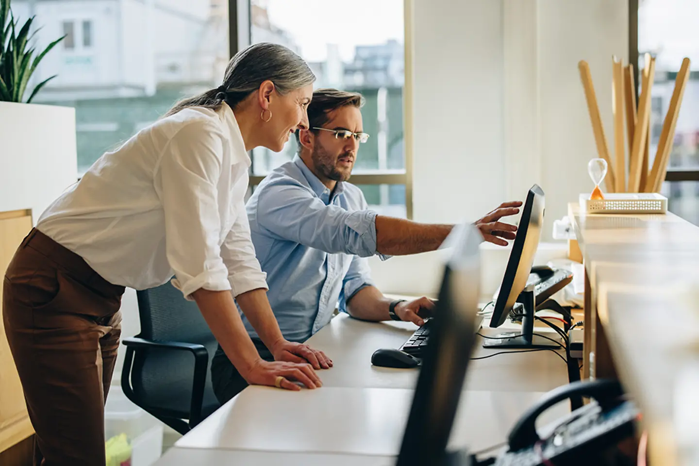 Two business people working together in office