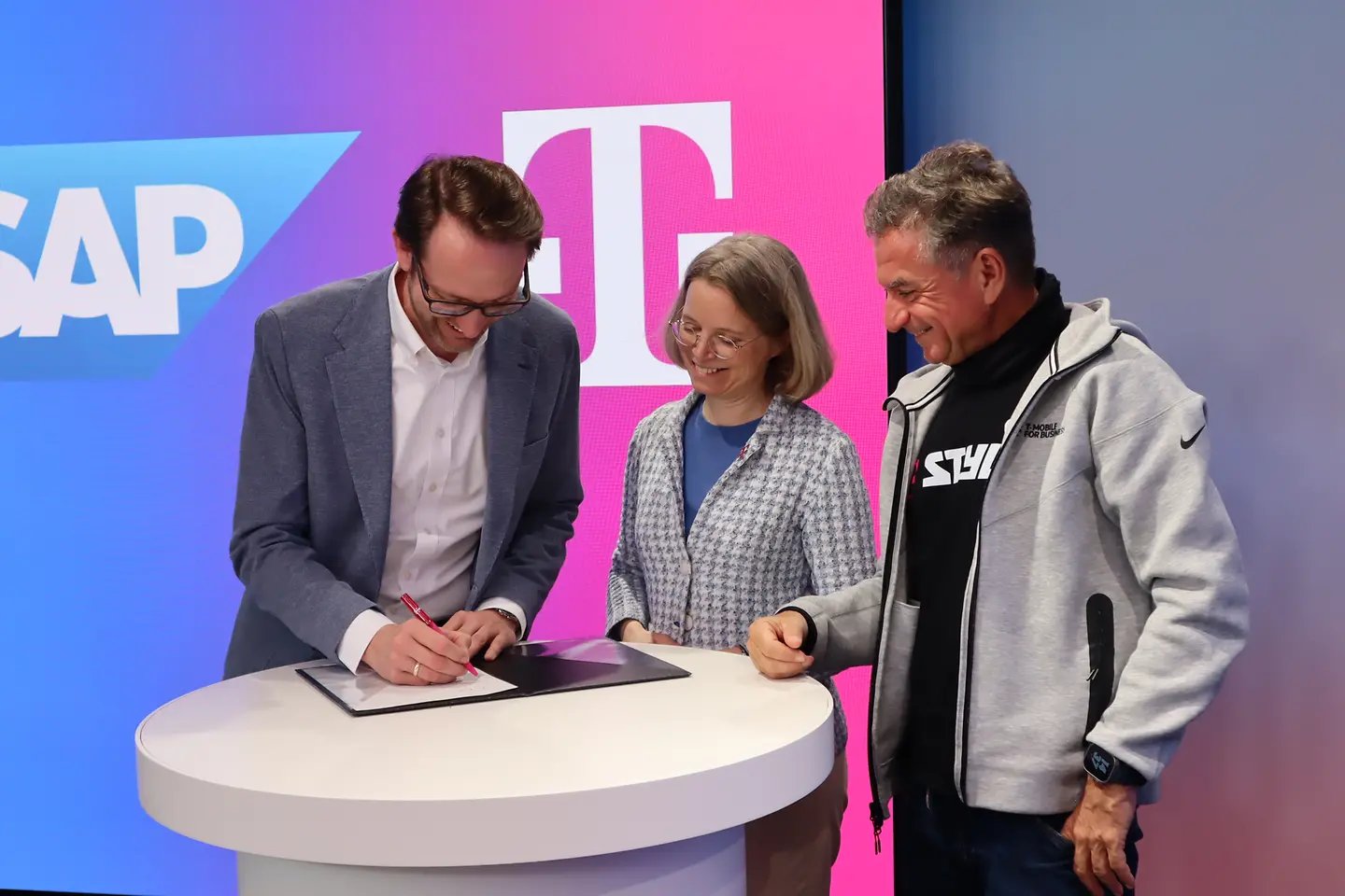 Members signing a document