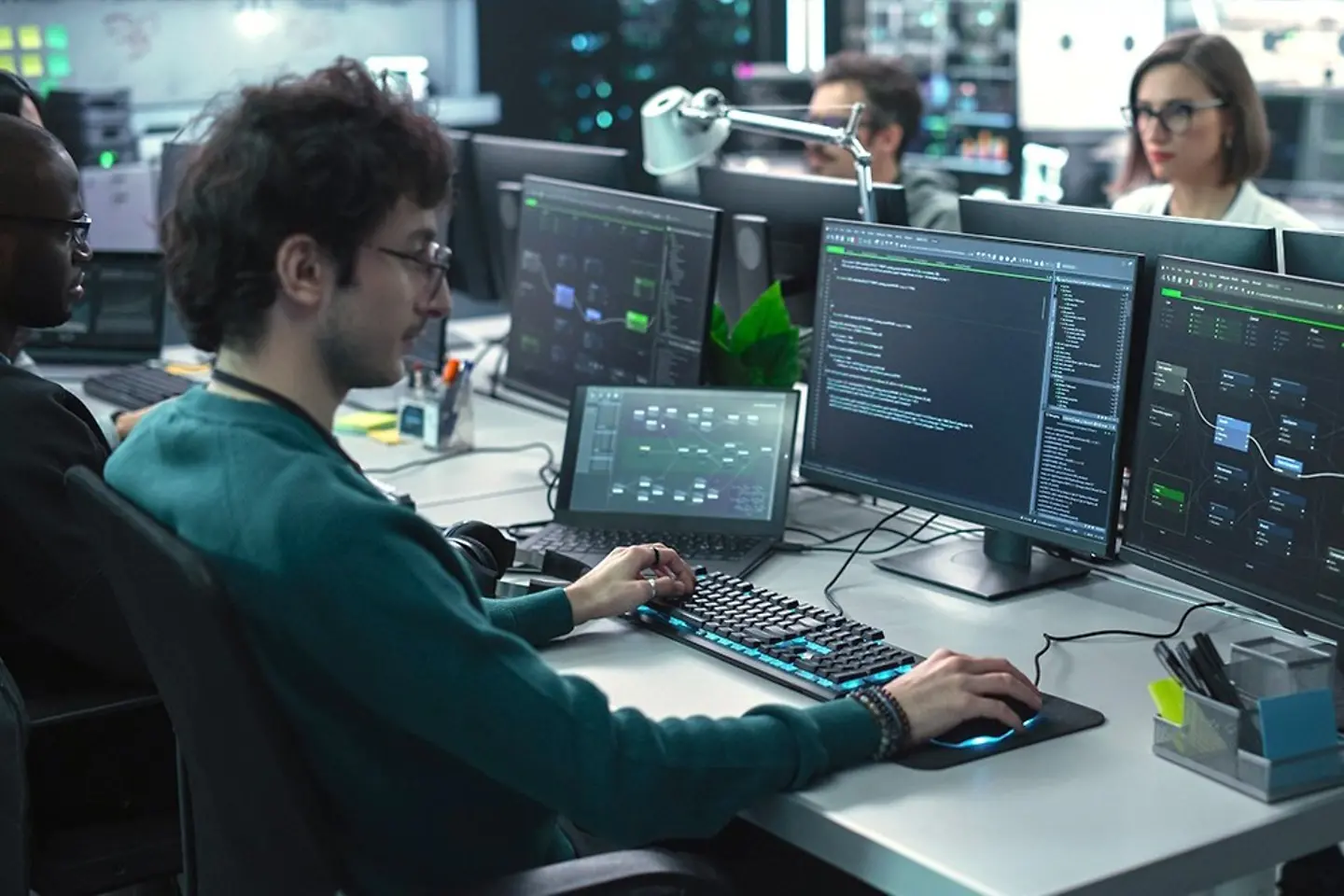 Team of software developers working on computers