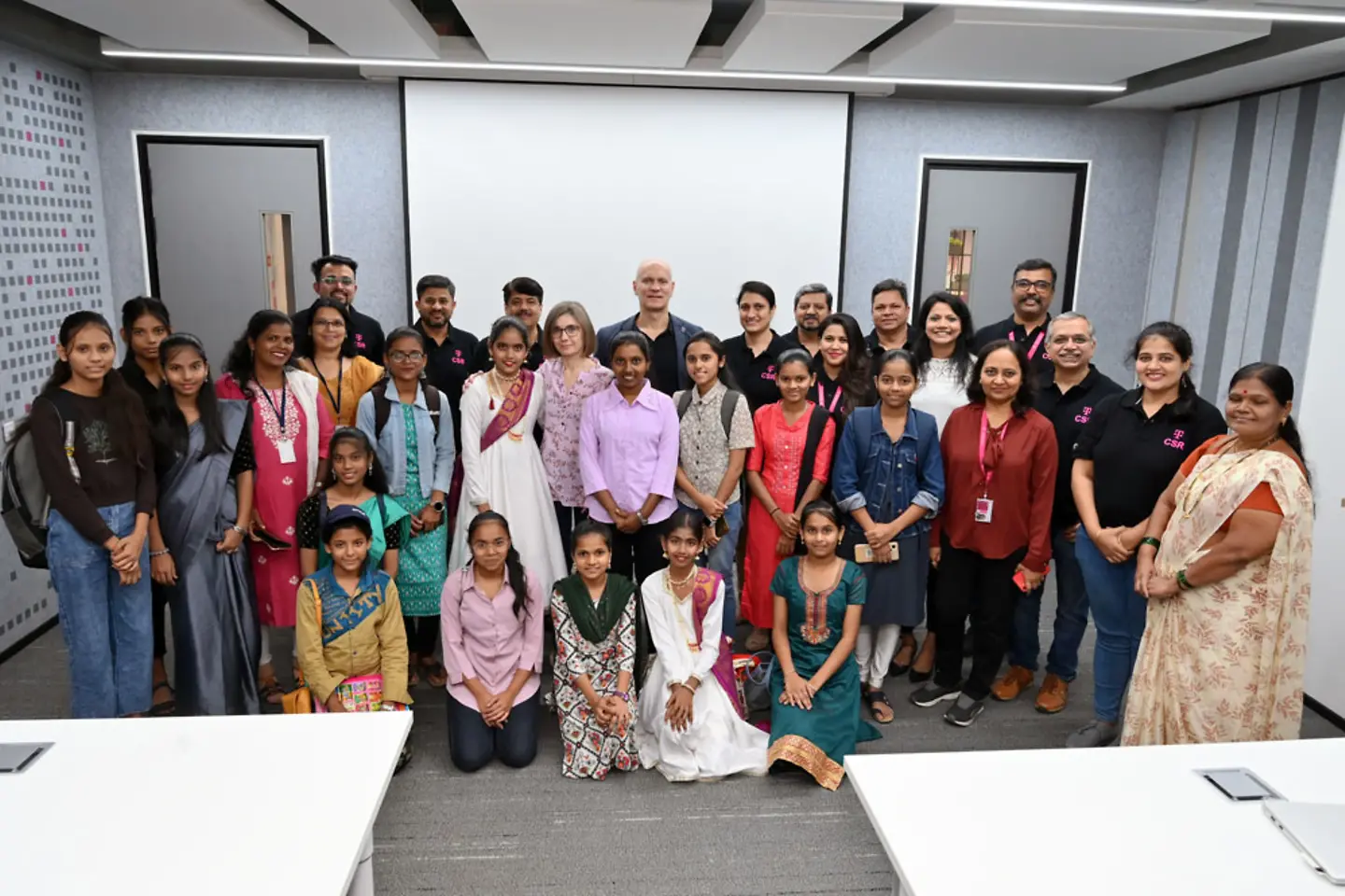 A school class with indian children and T-Systems India employees