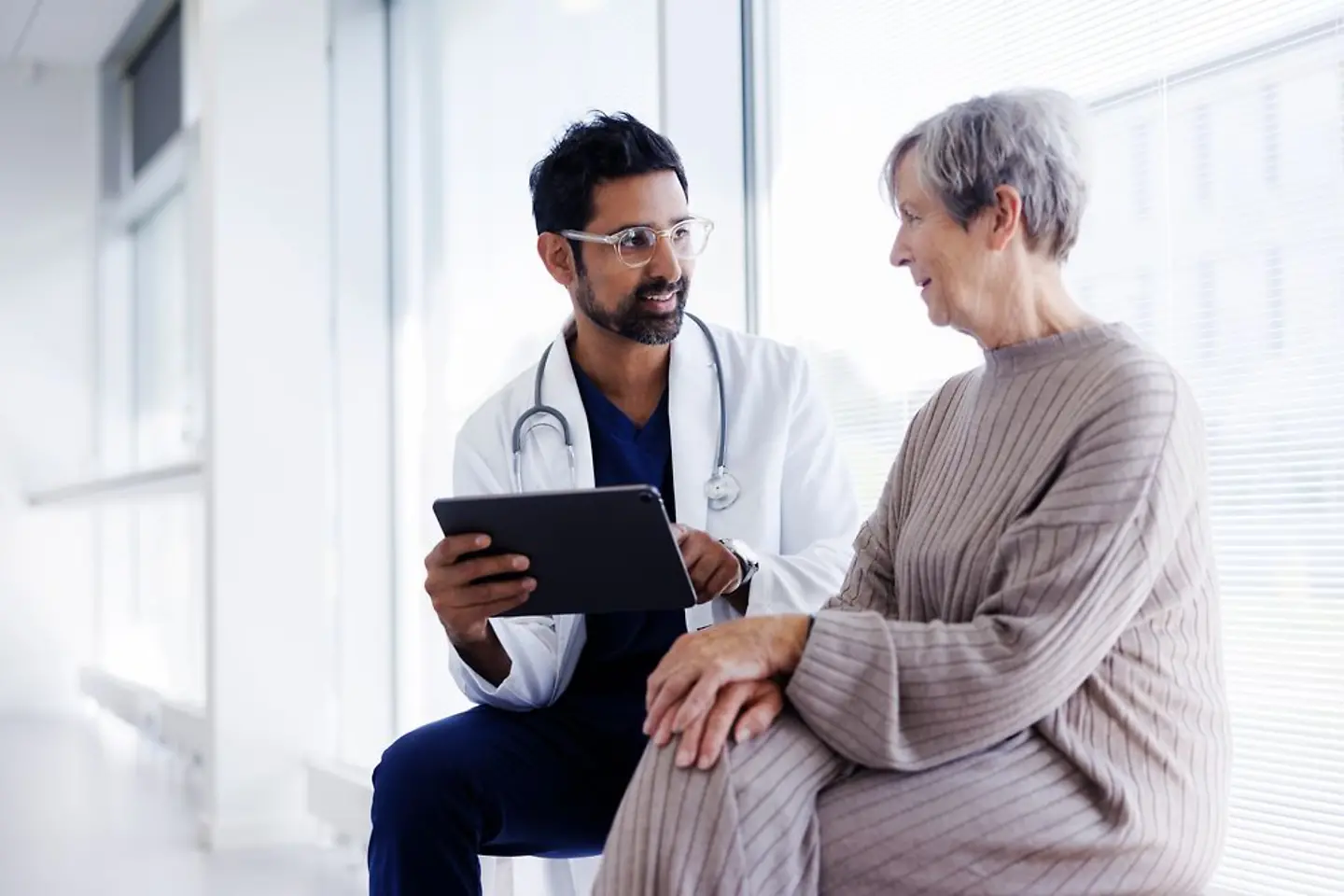 Digital identity, gematik, Healthcare, Doctor and patient checking digital patient records.